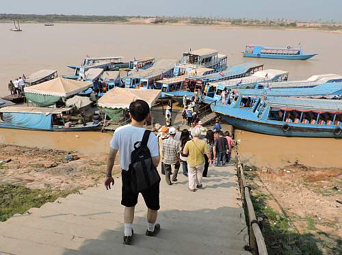 Boarding boats to the floating village